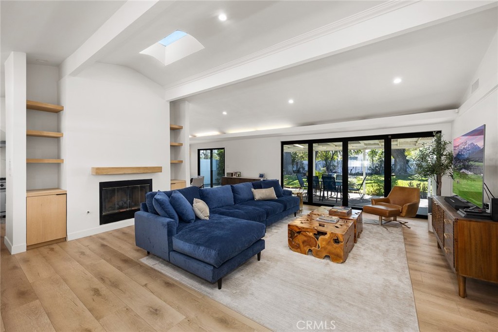 18234 Tribune Street Porter Ranch, CA 91326 - Photo 7 of 26 a living room with furniture large window and a fireplace