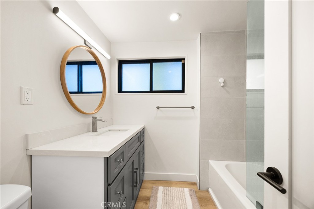 18234 Tribune Street Porter Ranch, CA 91326 - Photo 10 of 26 a bathroom with a sink and a mirror