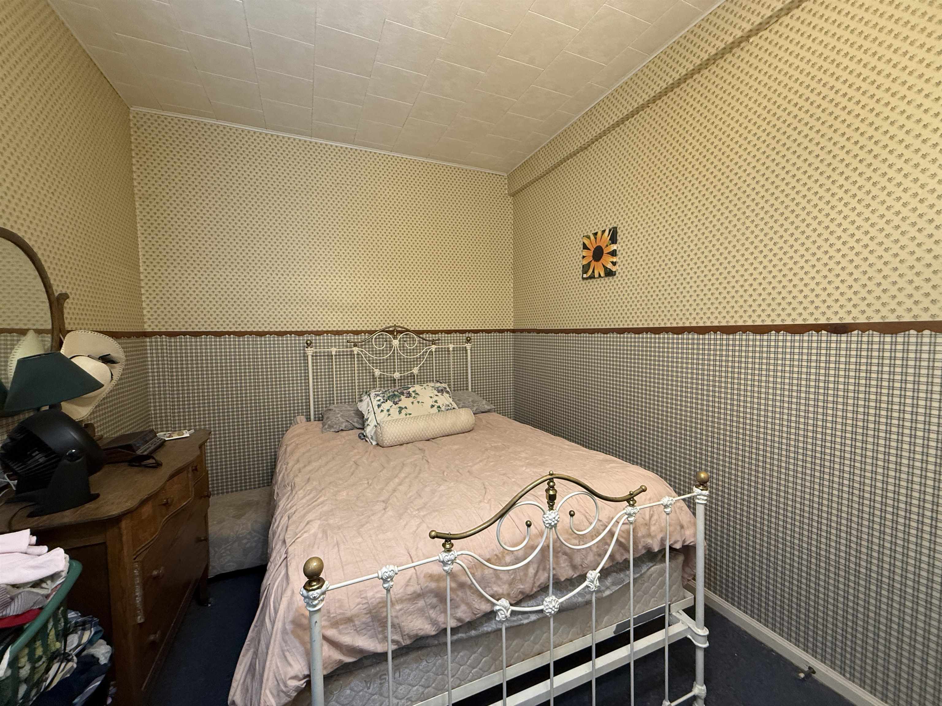 323 South Main Street Stockton, IL 61085 - Photo 14 of 32 a bedroom with a bed and wooden floor