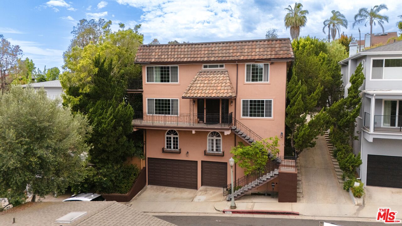 503 North Greencraig Road Los Angeles, CA 90049 - Photo 59 of 59 a front view of a house with a yard and garage