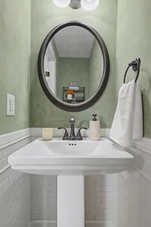 a bathroom with a sink and mirror