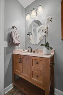 a bathroom with a sink and a mirror
