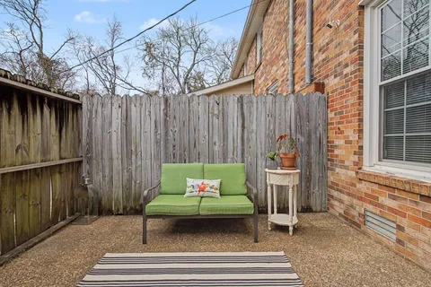 a outdoor space with patio furniture and potted plants