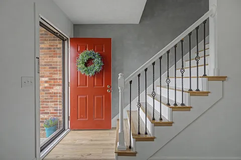 a view of entryway with wooden floor