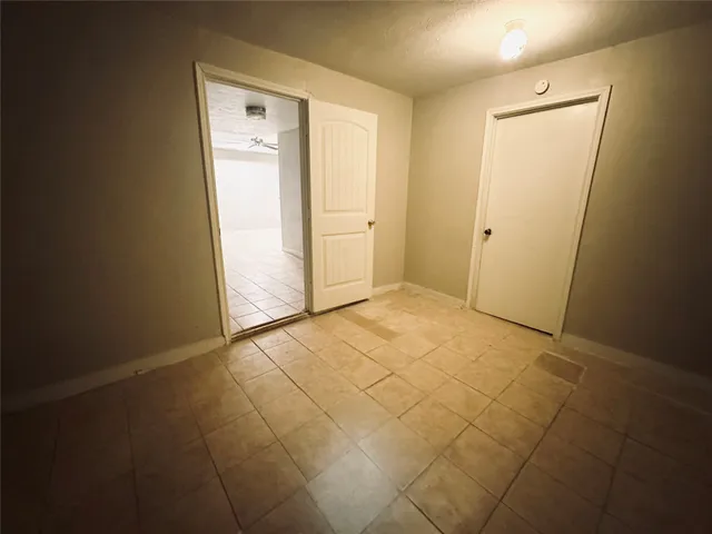 an empty room with a bathroom
