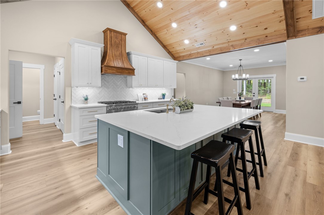 147 McAlister Road West Union, SC 29696 - Photo 8 of 50 Gleaming wood-paneled vaulted ceilings crown a spacious kitchen centered around a substantial island.