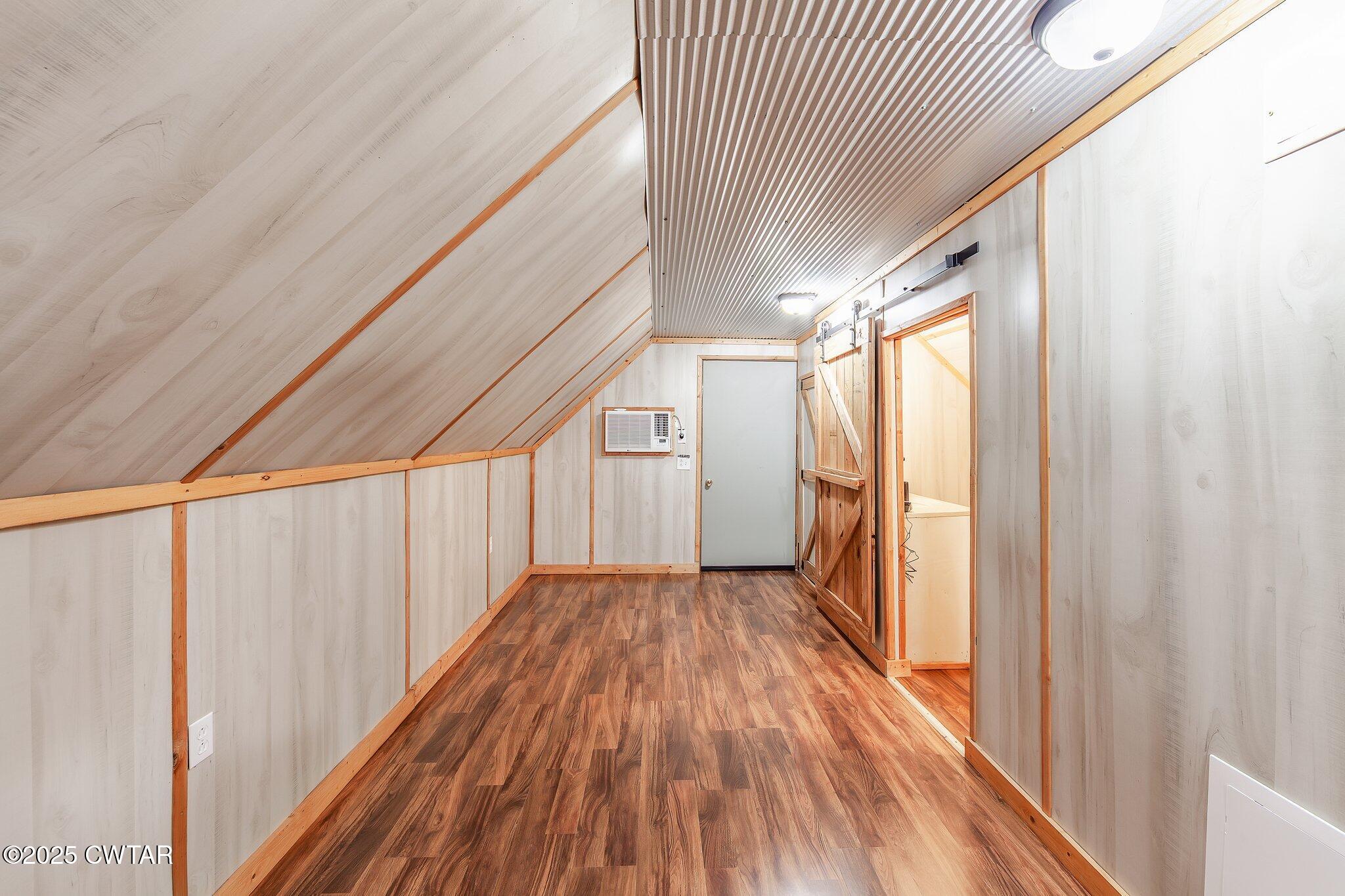 1276 Mifflin Road Jackson, TN 38301 - Photo 21 of 35 a view of a hallway with wooden floor and staircase
