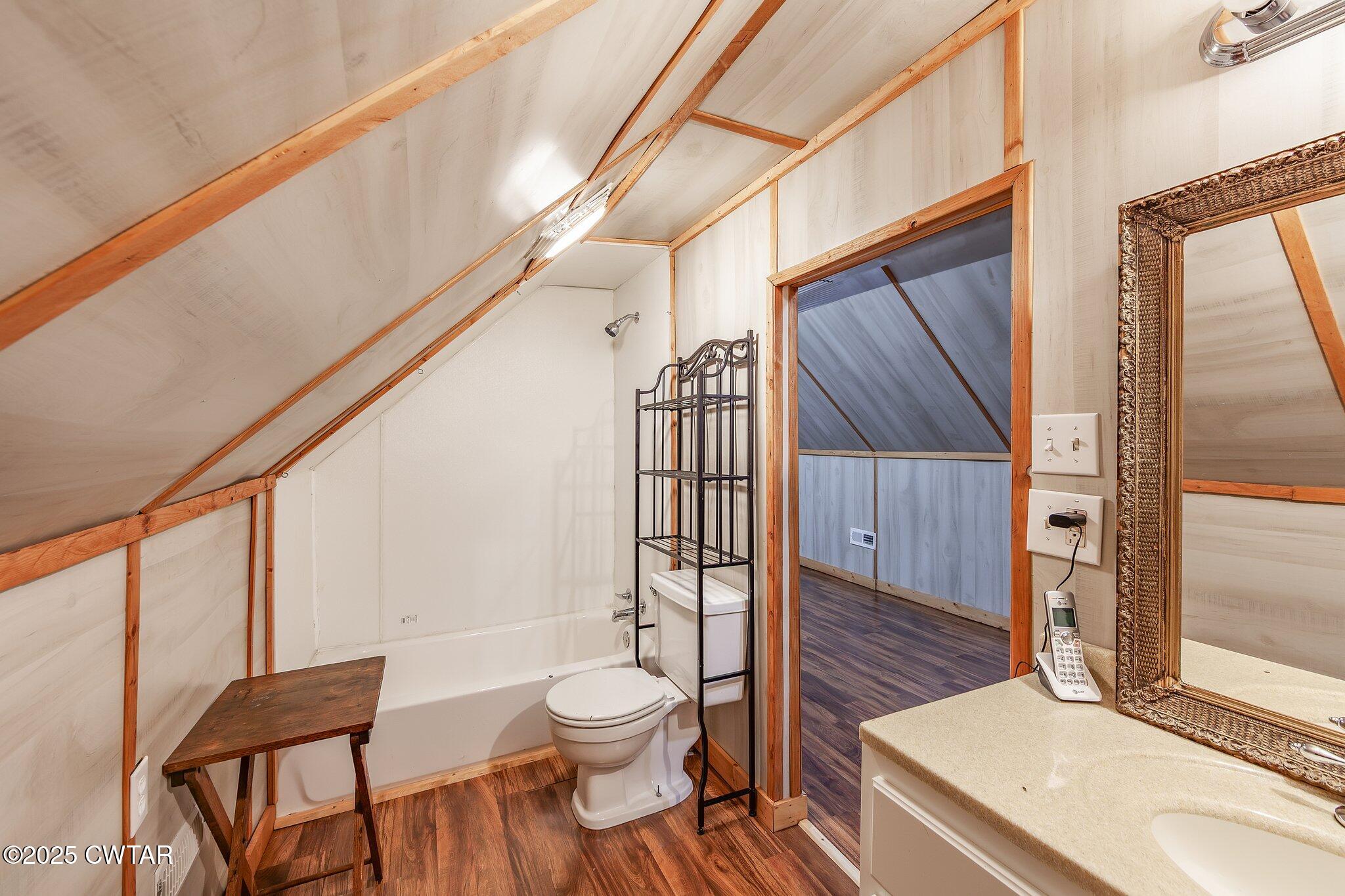 1276 Mifflin Road Jackson, TN 38301 - Photo 24 of 35 a bathroom with a toilet a sink and shower