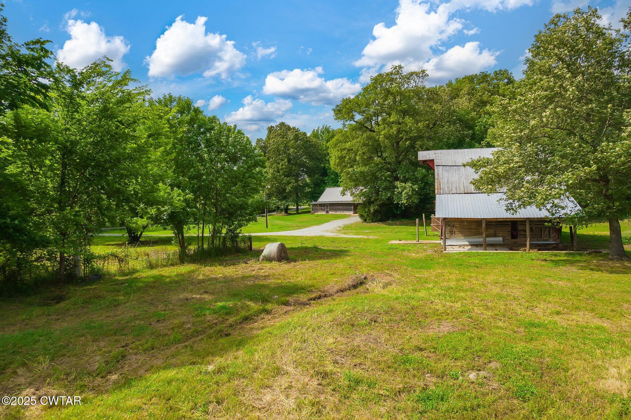 1276 Mifflin Road Jackson, TN 38301 - Photo 30 of 35 a view of a house with a big yard