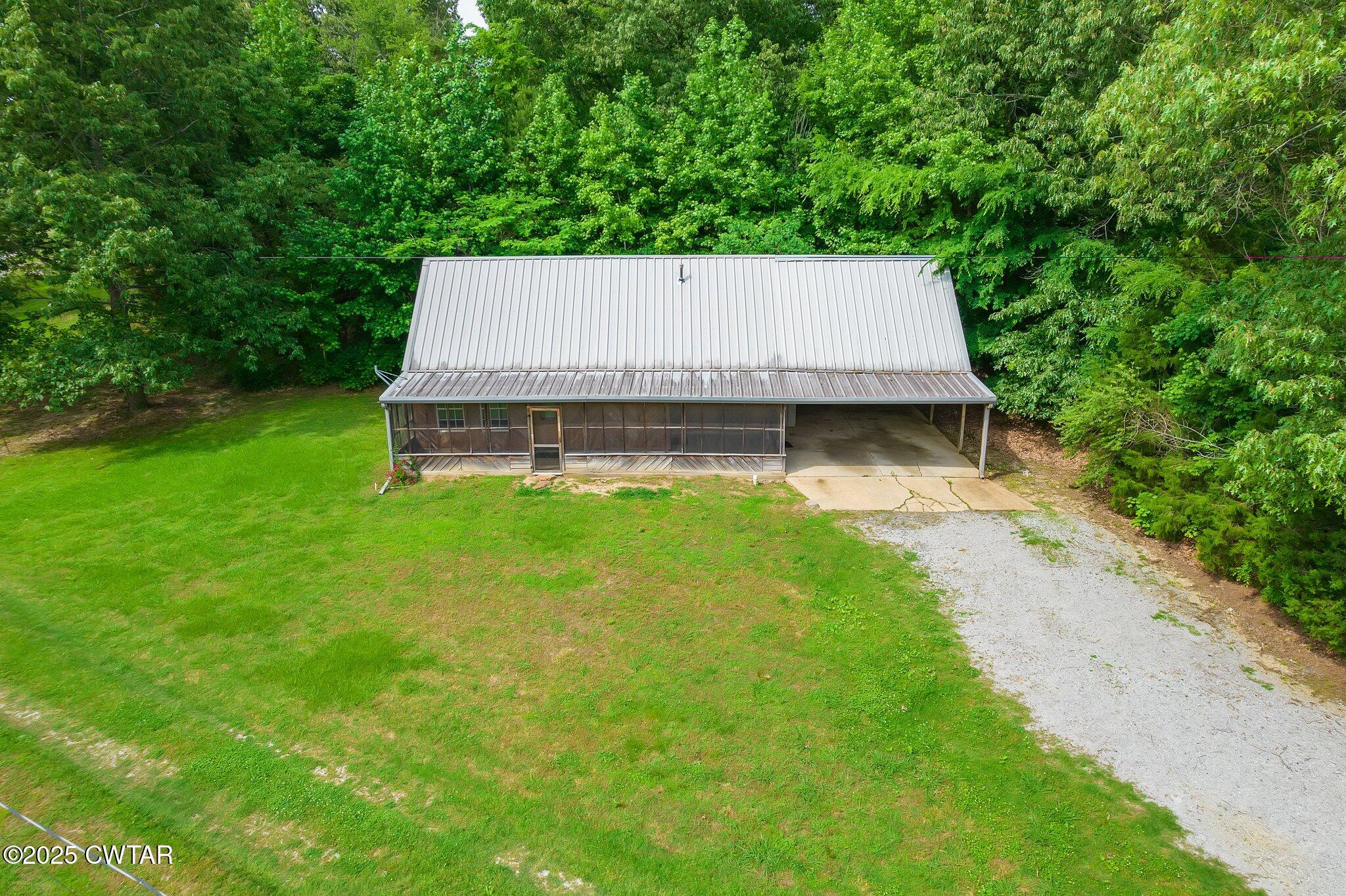 1276 Mifflin Road Jackson, TN 38301 - Photo 4 of 35 a view of a small house with a yard