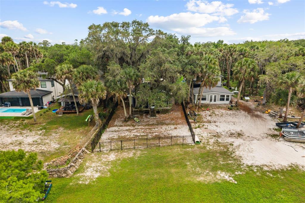 2462 Fort Lane Road Geneva, FL 32732 - Photo 30 of 31 a view of a lake with a house in the background