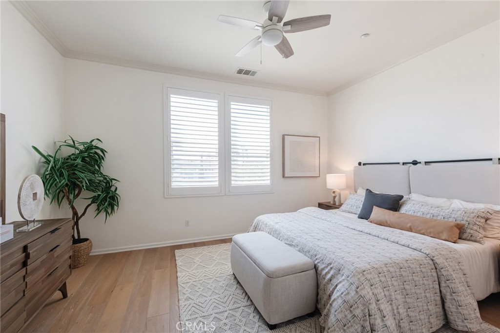 5341 Strand, Unit 105 Hawthorne, CA 90250 - Photo 19 of 67 a bedroom with bed and a potted plant
