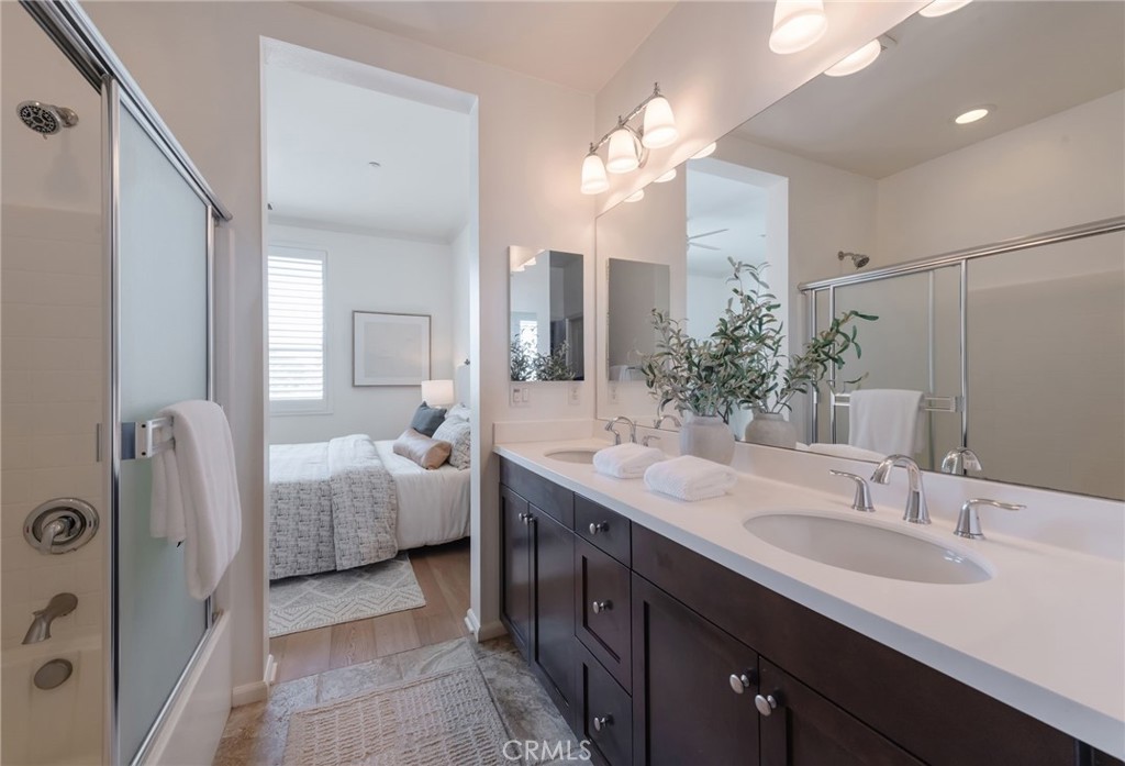 5341 Strand, Unit 105 Hawthorne, CA 90250 - Photo 22 of 67 a spacious bathroom with a double vanity sink mirror and bathtub