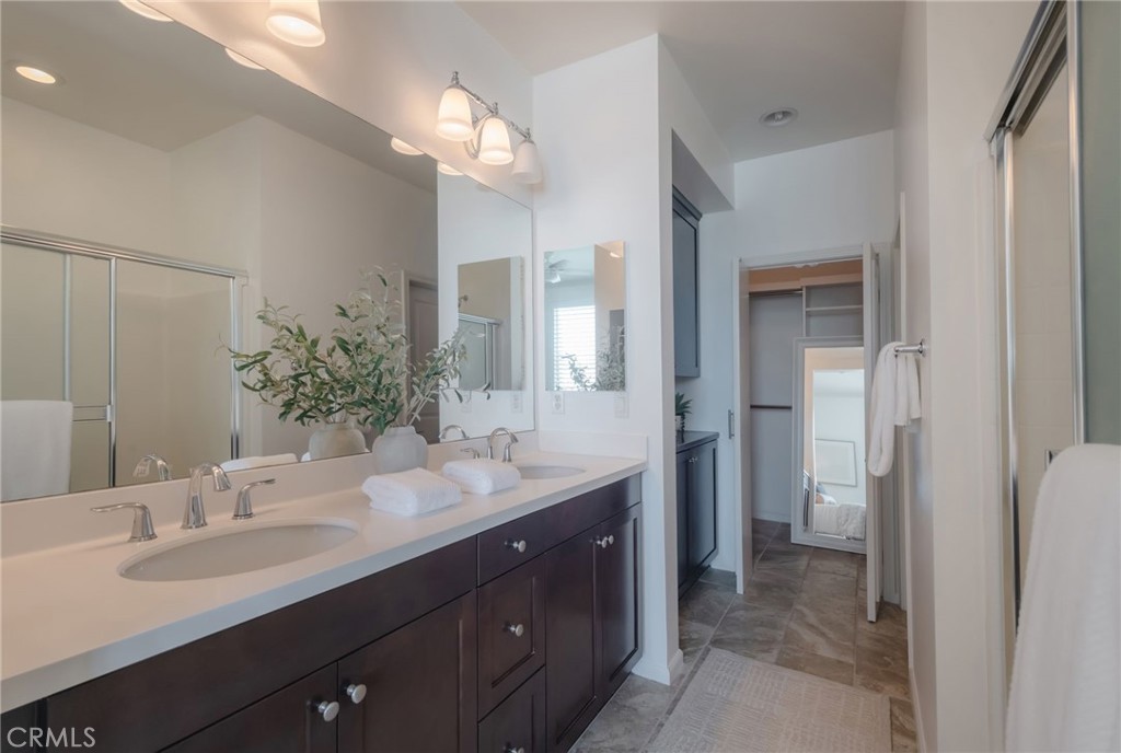5341 Strand, Unit 105 Hawthorne, CA 90250 - Photo 23 of 67 a bathroom with a double vanity sink and a mirror