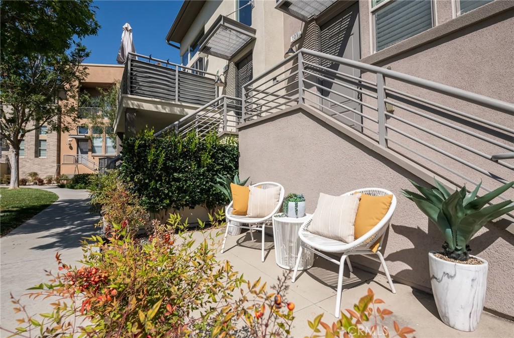 5341 Strand, Unit 105 Hawthorne, CA 90250 - Photo 3 of 67 a view of a patio with table and chairs and potted plants