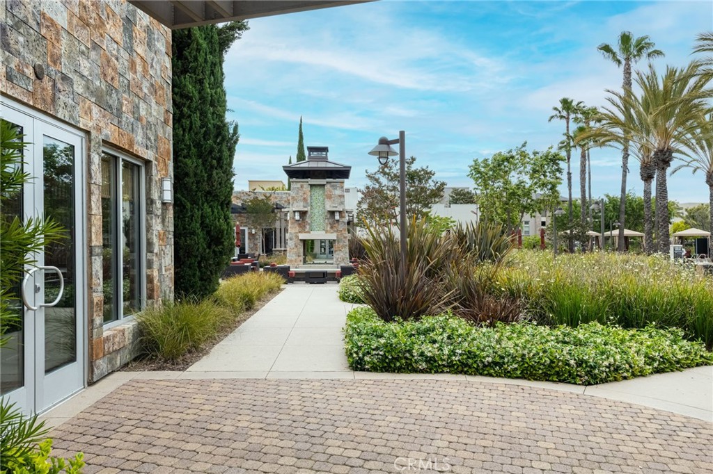5341 Strand, Unit 105 Hawthorne, CA 90250 - Photo 46 of 67 a front view of a house with a yard and potted plants