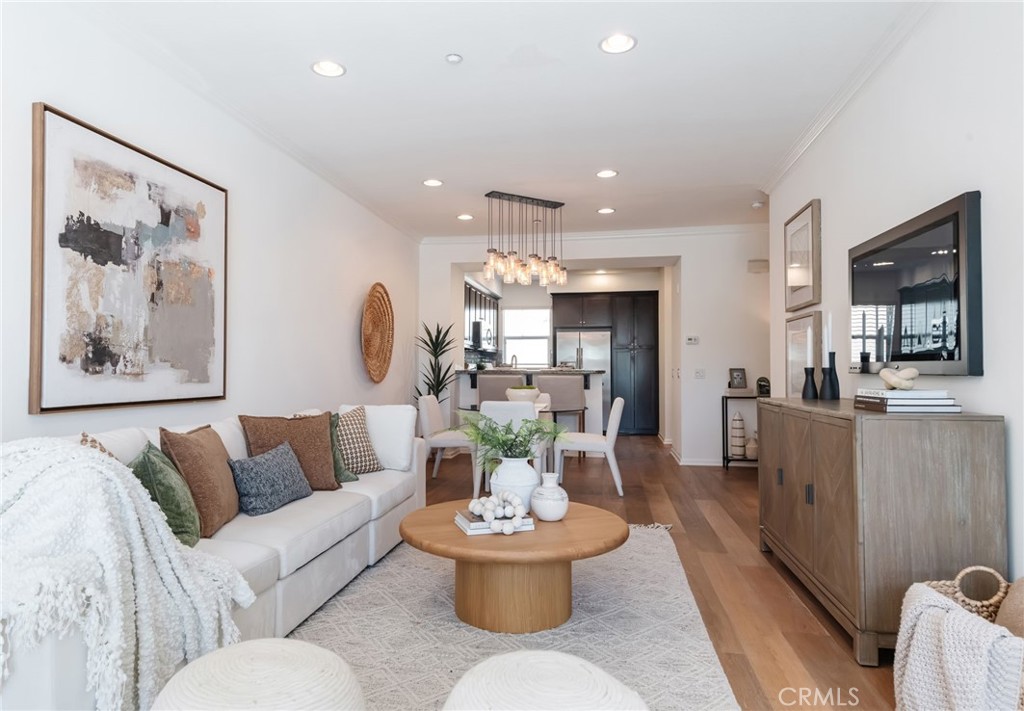 5341 Strand, Unit 105 Hawthorne, CA 90250 - Photo 5 of 67 a living room with furniture and a large window