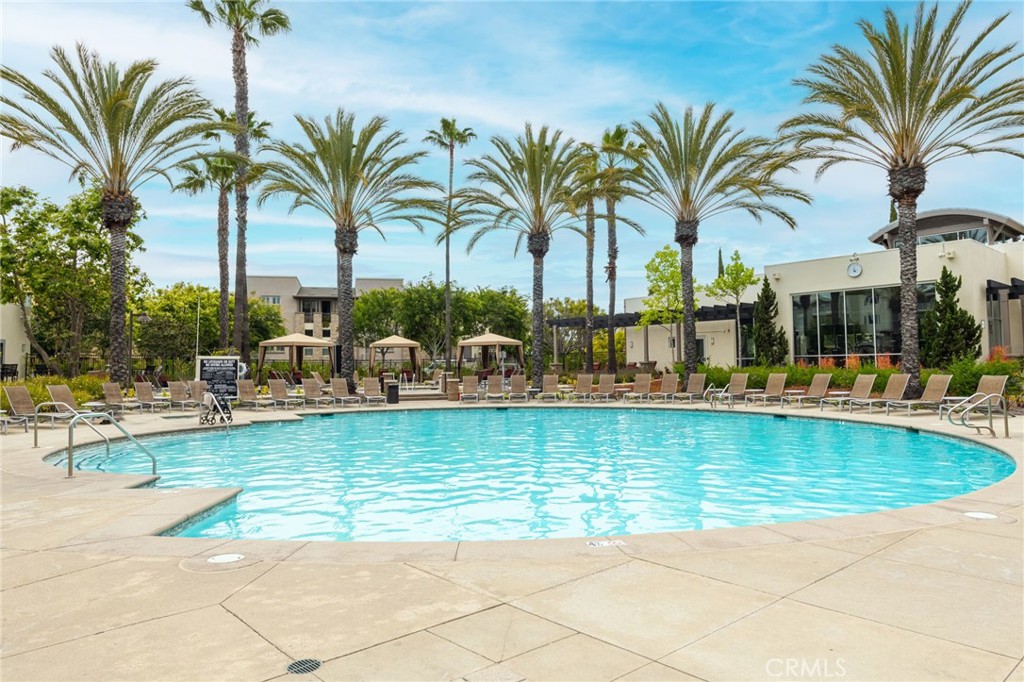 5341 Strand, Unit 105 Hawthorne, CA 90250 - Photo 51 of 67 a view of a swimming pool with a table and chairs
