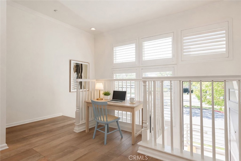5341 Strand, Unit 105 Hawthorne, CA 90250 - Photo 9 of 67 a workspace with wooden floor and a window