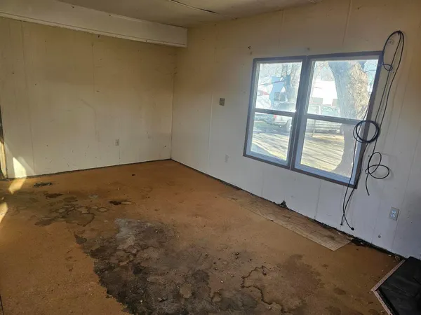 a view of livingroom with furniture and window