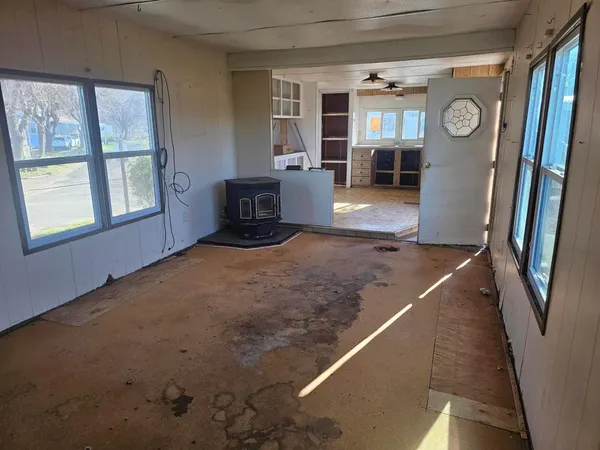 a view of an empty room with closet area