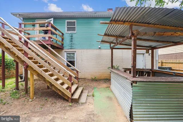 a view of a deck with wooden floor and outdoor space