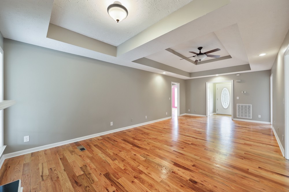 323 Independence Street Springfield, TN 37172 - Photo 11 of 37 a view of empty room with wooden floor and ceiling fan