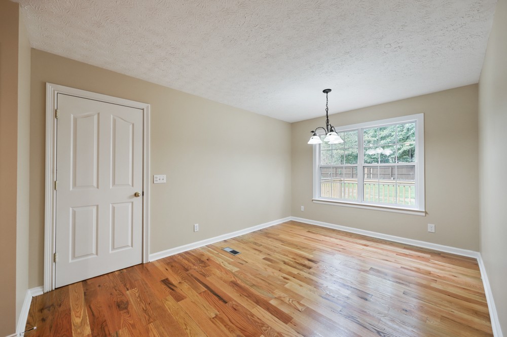 323 Independence Street Springfield, TN 37172 - Photo 16 of 37 a view of empty room with wooden floor and fan