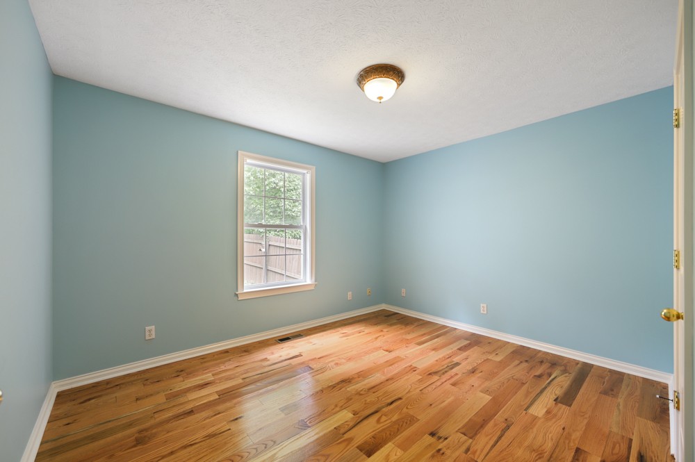 323 Independence Street Springfield, TN 37172 - Photo 24 of 37 an empty room with wooden floor and windows