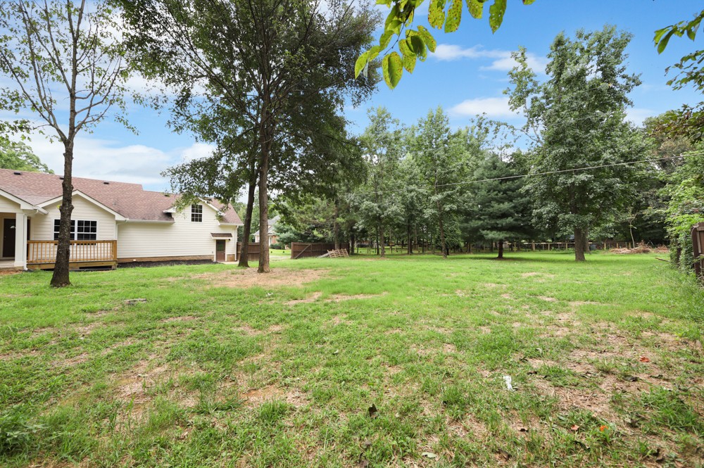 323 Independence Street Springfield, TN 37172 - Photo 31 of 37 a view of a house with backyard and trees