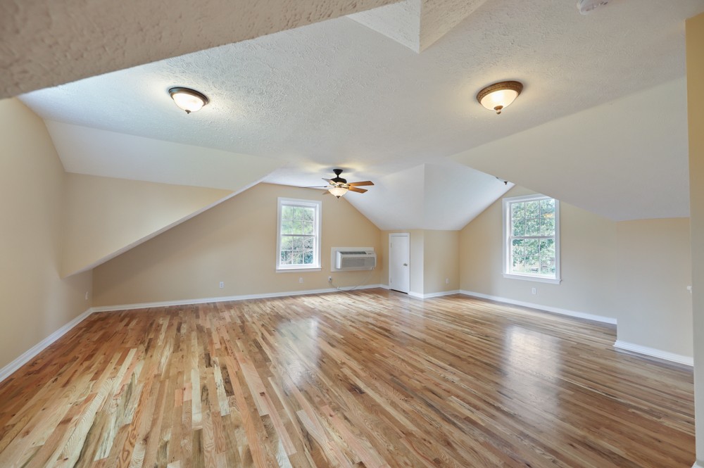 323 Independence Street Springfield, TN 37172 - Photo 32 of 37 a view of an empty room with wooden floor and a window