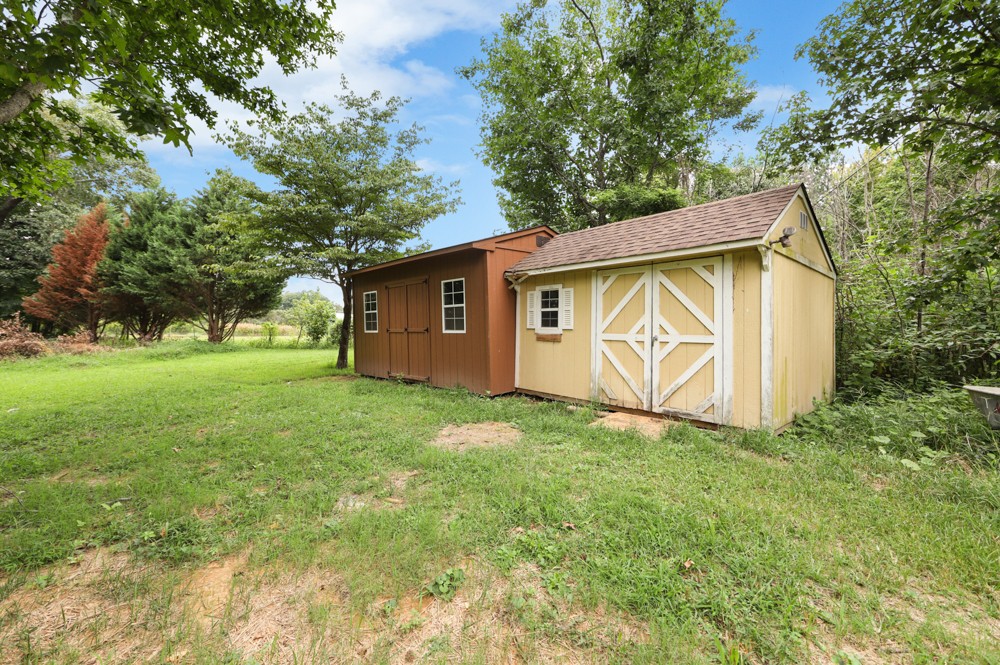 323 Independence Street Springfield, TN 37172 - Photo 35 of 37 a view of backyard with garden and trees