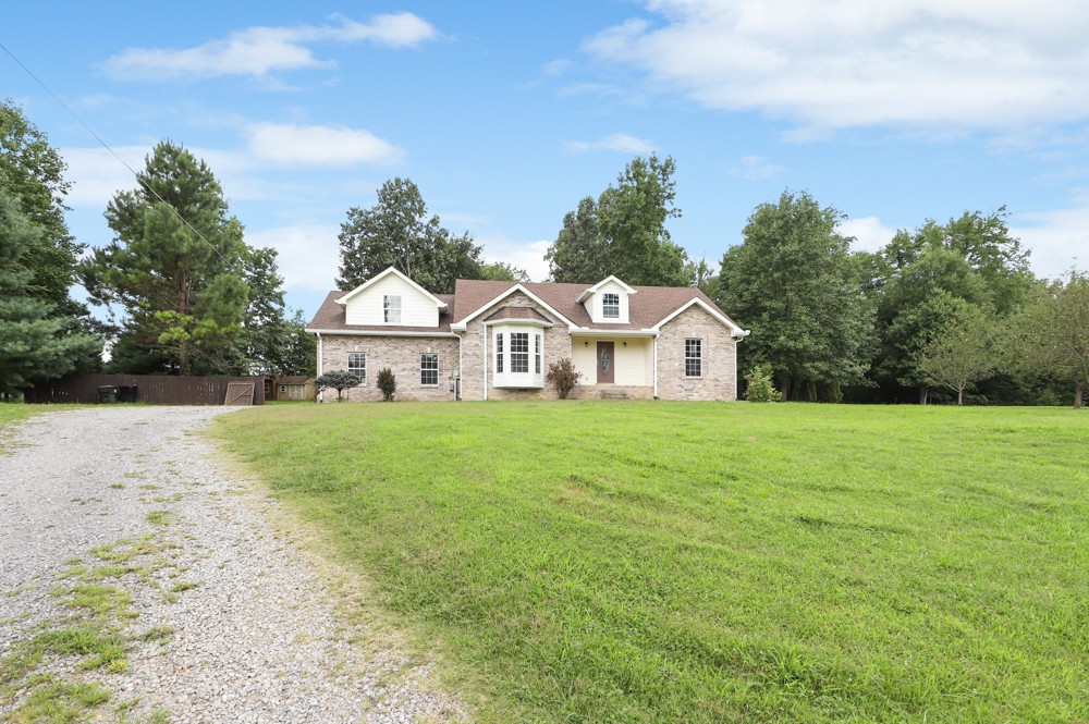 323 Independence Street Springfield, TN 37172 - Photo 4 of 37 a aerial view of a house with yard and trees in the background