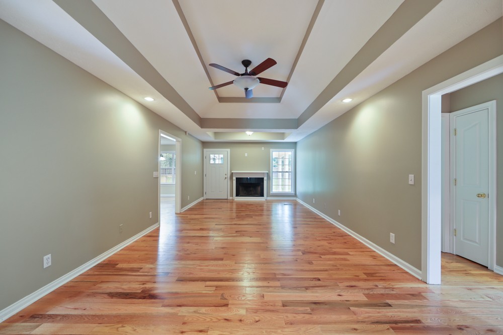 323 Independence Street Springfield, TN 37172 - Photo 9 of 37 a view of empty room with wooden floor and fireplace