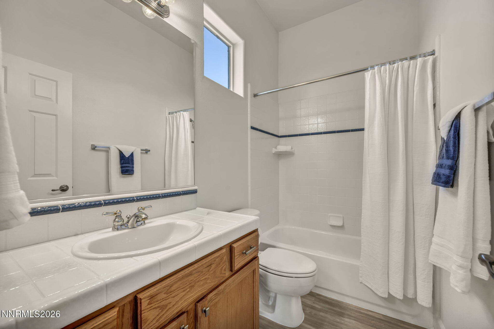 574 Echo Ridge Court Reno, NV 89511 - Photo 42 of 58 a bathroom with a granite countertop sink toilet and shower