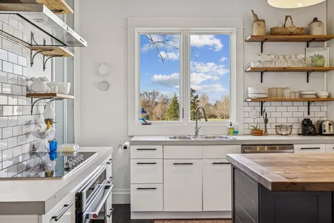 a bathroom with a sink double vanity and a mirror
