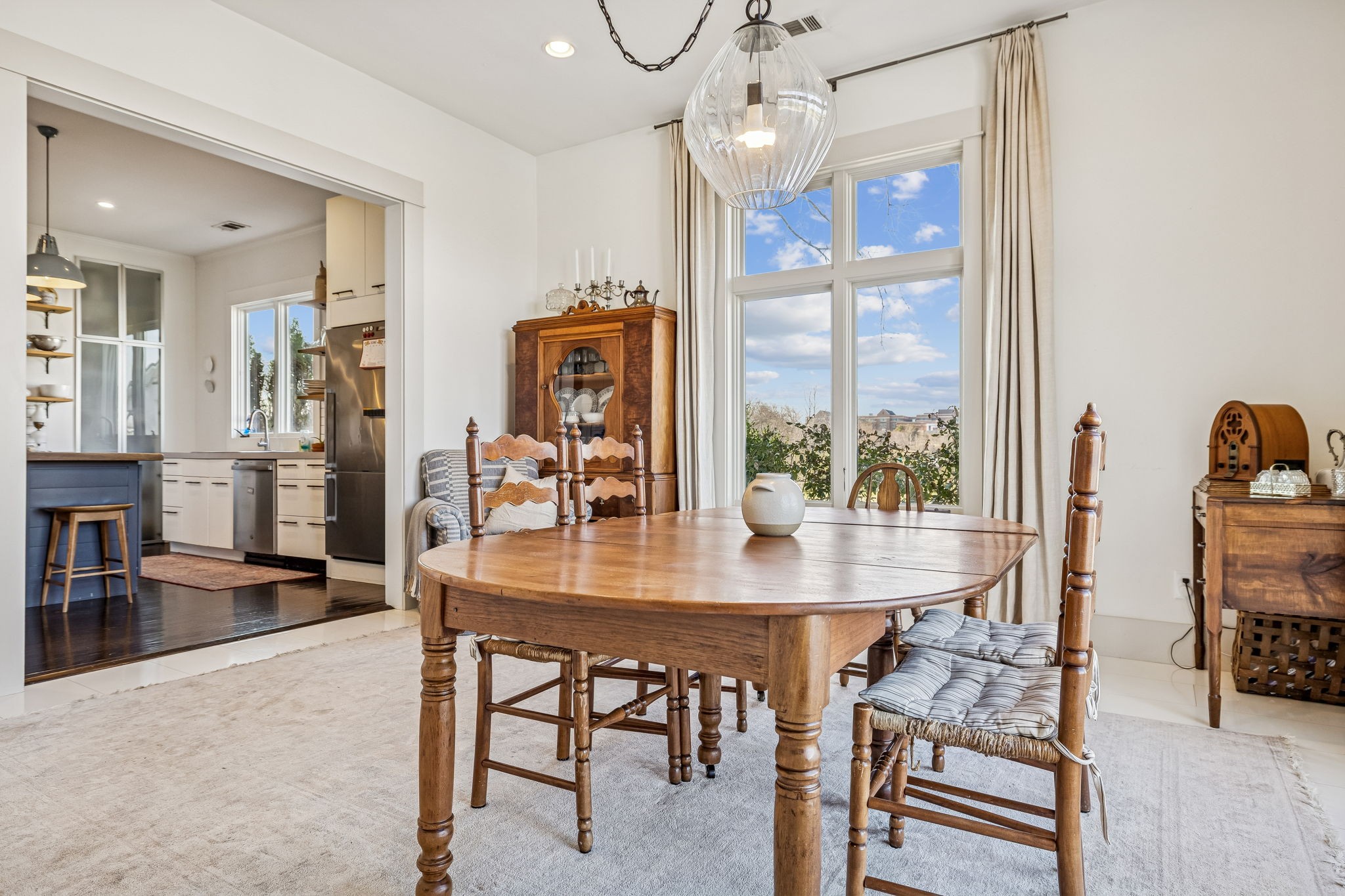 6320 Arno Road Franklin, TN 37064 - Photo 15 of 48 a dining room with furniture a chandelier and wooden floor