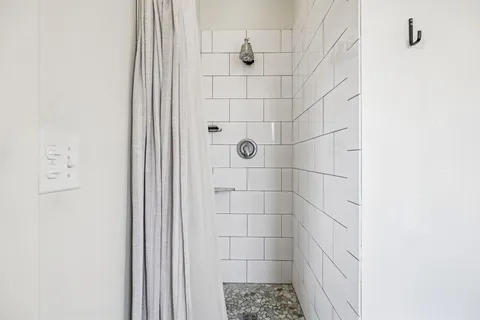 a bedroom with a bed and a tv