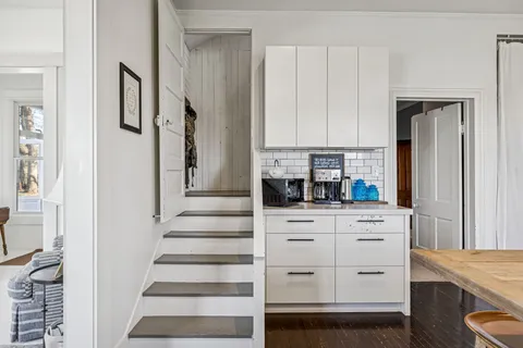 a view of a livingroom with furniture and a window