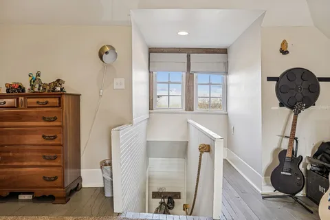 a bedroom with furniture and a book shelf