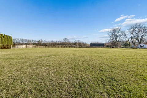 a view of an ocean with a building in the background
