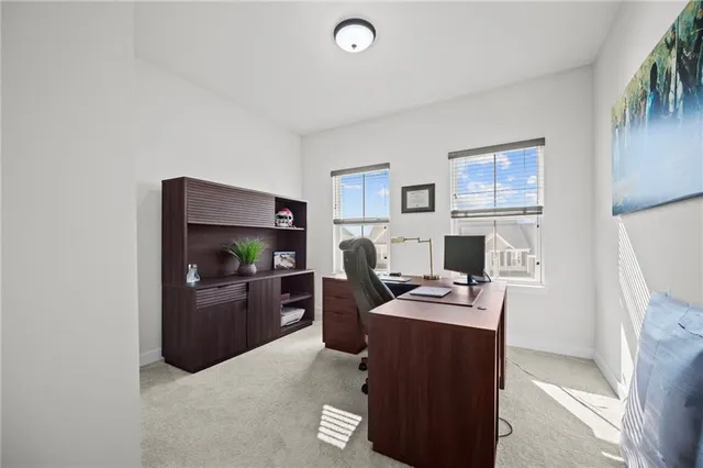 a work room with furniture and a fireplace