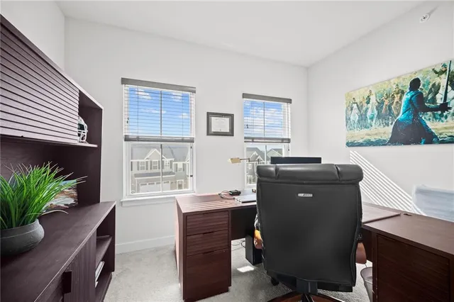 a workspace with furniture and a window