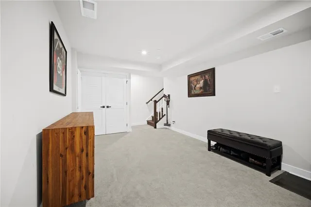 a view of a livingroom with furniture and a ceiling fan