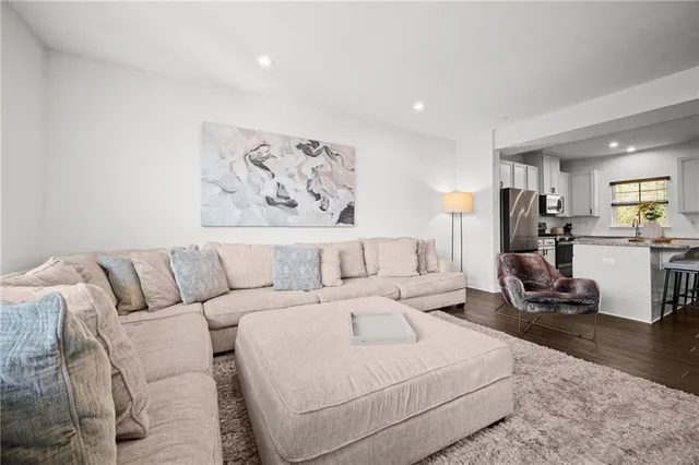 a bedroom with a bed and a couch