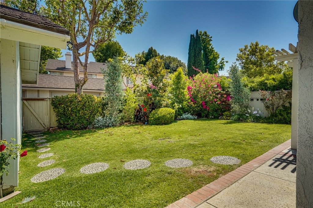49 East Yale Loop, Unit 26 Irvine, CA 92604 - Photo 48 of 63 a view of a backyard with plants