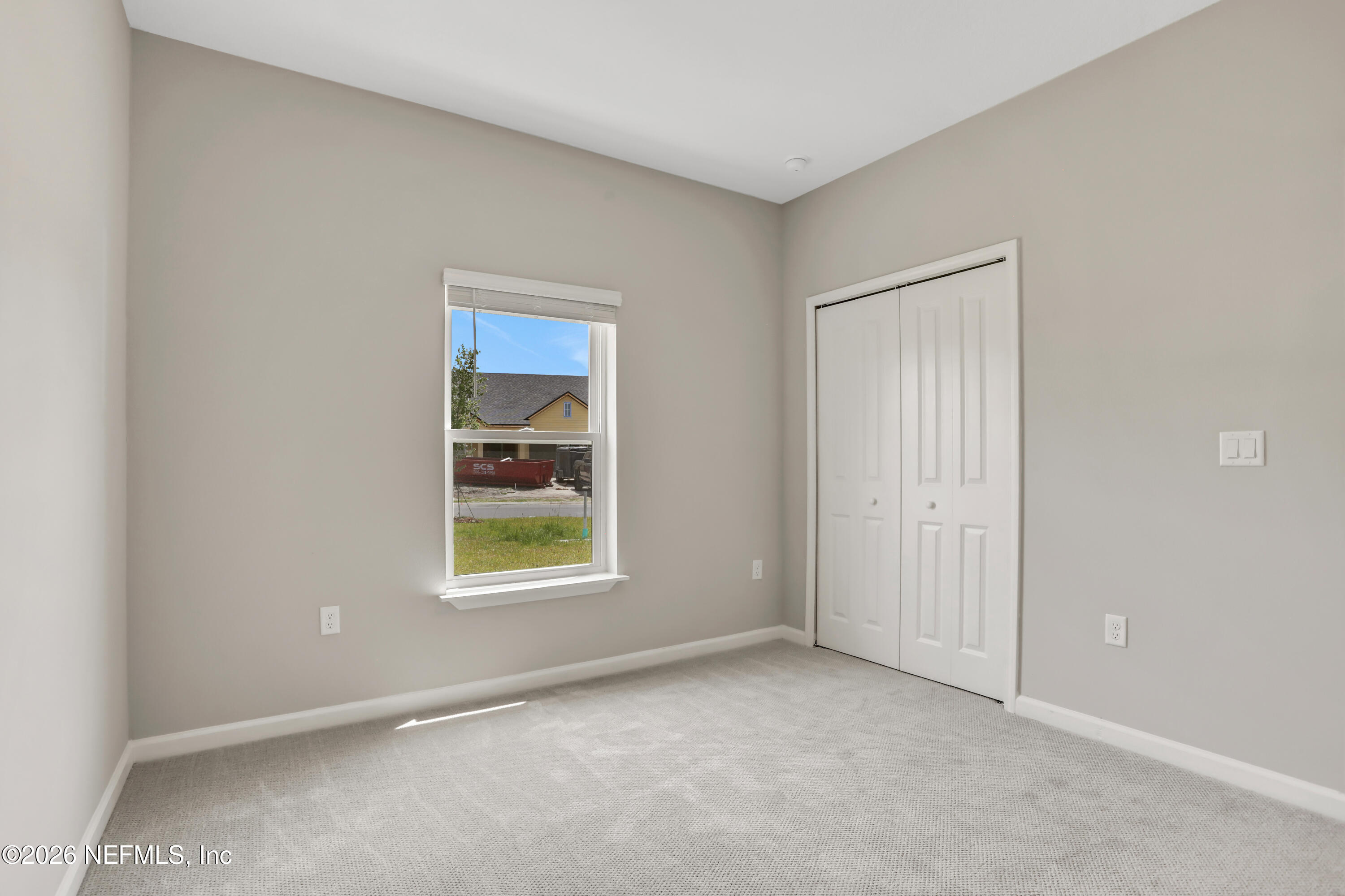 3157 Gadwall Road Orange Park, FL 32065 - Photo 23 of 36 an empty room with windows and closet