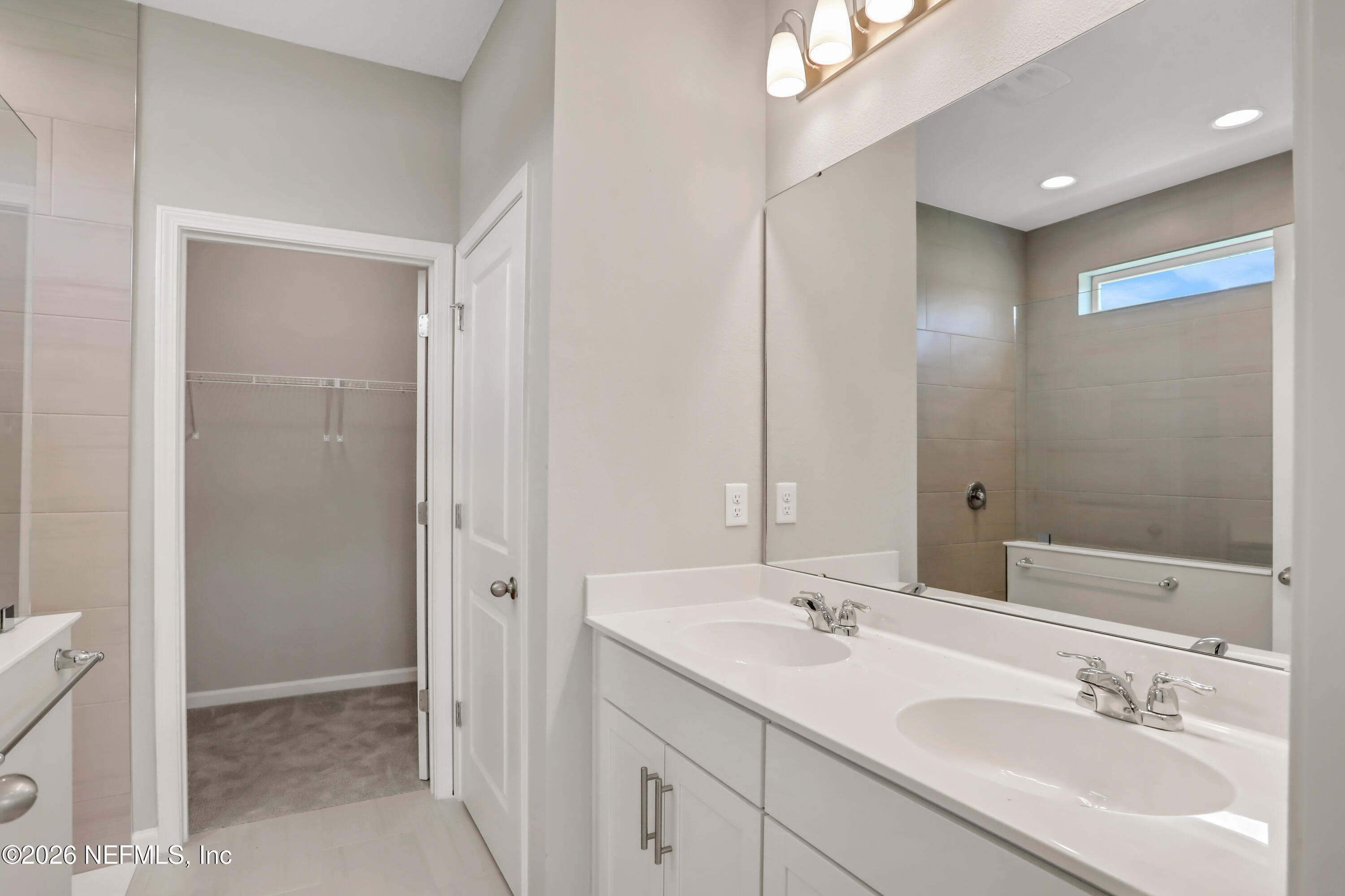 3157 Gadwall Road Orange Park, FL 32065 - Photo 26 of 36 a bathroom with 2 sink and a mirror