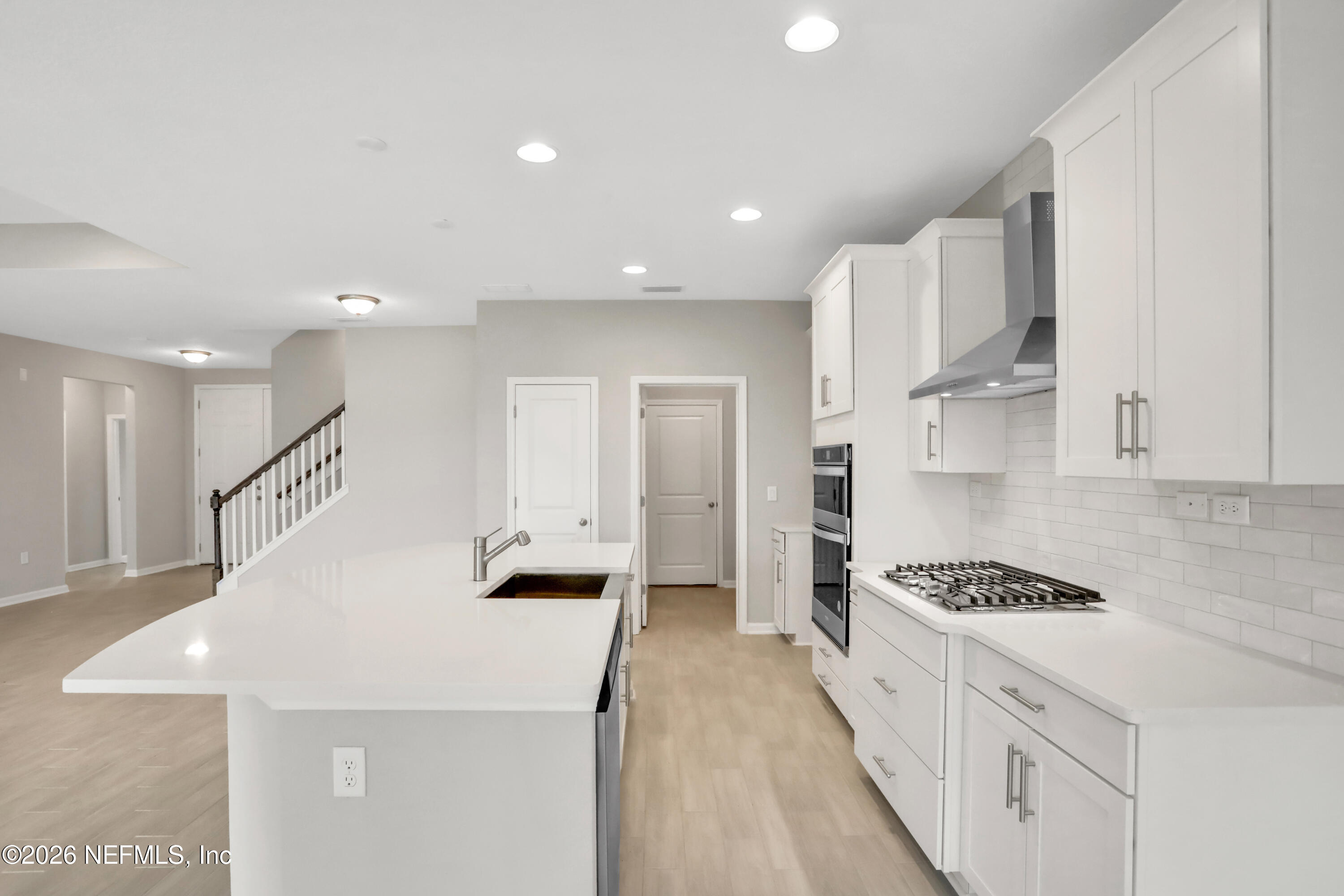 3157 Gadwall Road Orange Park, FL 32065 - Photo 5 of 36 a kitchen with stainless steel appliances kitchen island sink refrigerator and stove