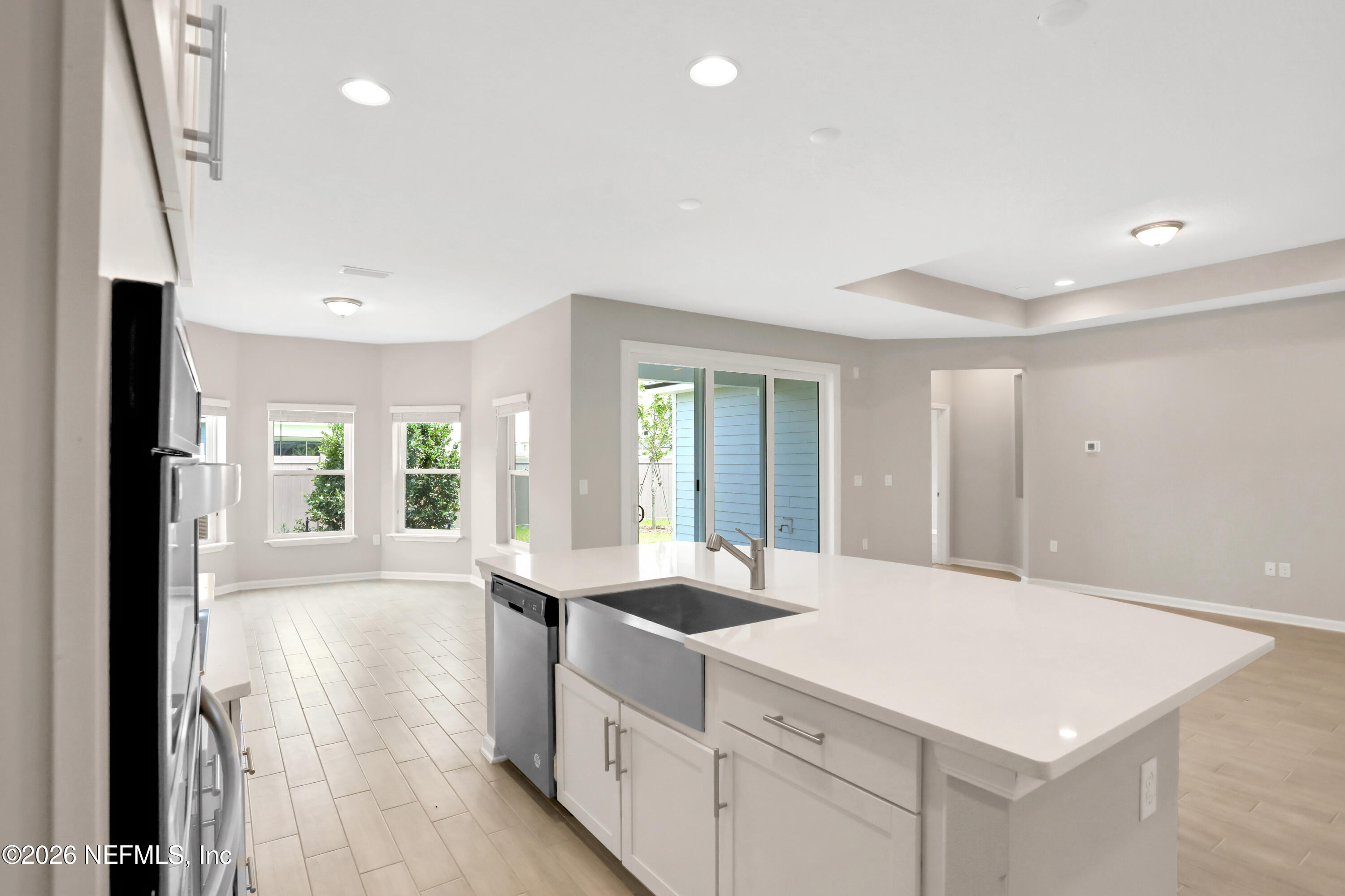 3157 Gadwall Road Orange Park, FL 32065 - Photo 8 of 36 a kitchen with granite countertop a sink and dishwasher with a large window